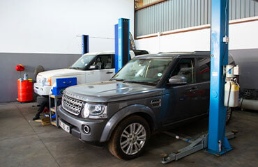 Land Rover standing within service station